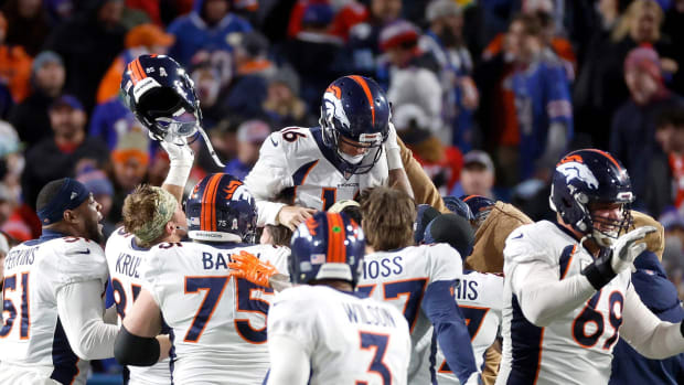 Denver Broncos place kicker Wil Lutz (16) is hoisted on his teammates shoulders after kicking the game winning field goal for a 24-22 win over the Bills.  